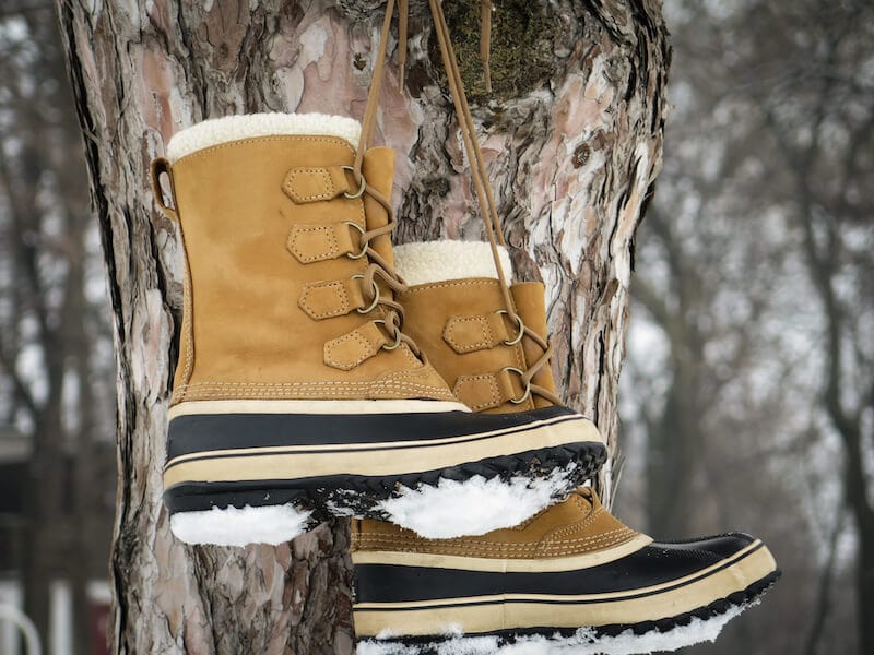 Comfortable winter boots covered in snow.